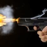 SHUTTERSTOCK GUNSHOT GUN FIRING
