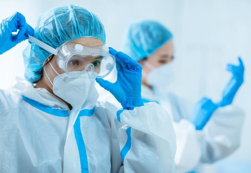 asian docs putting on ppe